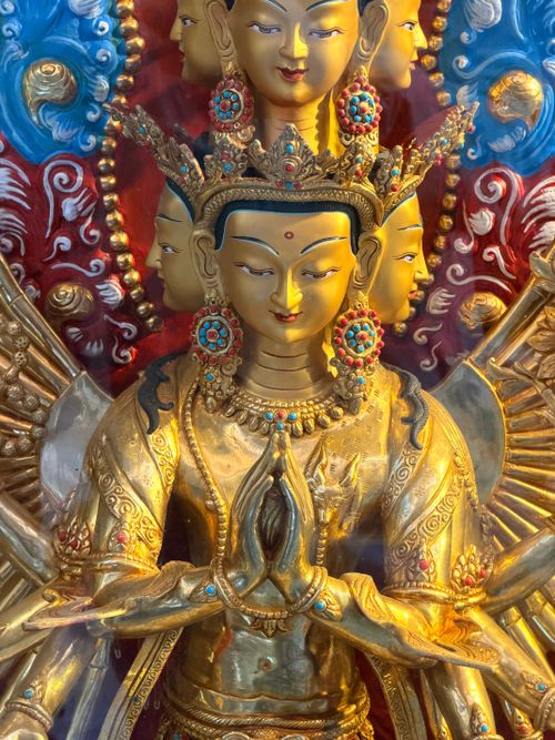 Free A detailed multi-headed Buddhist statue with vibrant colors, showcasing traditional craftsmanship. Stock Photo