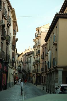 Discover the quaint architecture and inviting streets of Granada's historic city center.
