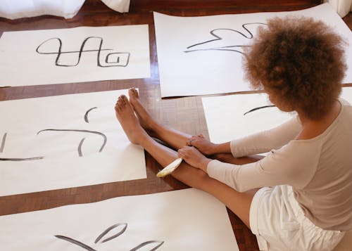 Woman Surrounded With Artwork