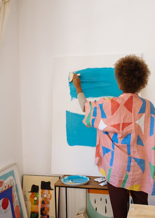 Free Photo Of Woman Painting With Blue Paint Stock Photo