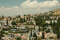 A scenic view of the Albayzín neighborhood with traditional Andalusian architecture in Granada, Spain.