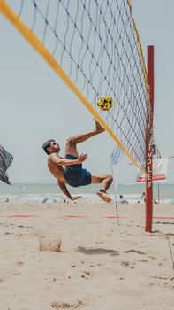 Player showing skill in a thrilling beach volleyball game at Mar del Plata, Argentina.