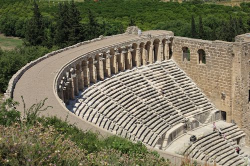 Free Explore the grandeur of the ancient Roman amphitheatre in Antalya, Türkiye, under the summer sun. Stock Photo