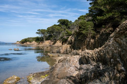 Free Serene coastal scene with rocky cliffs and azure waters in Provence, France. Stock Photo