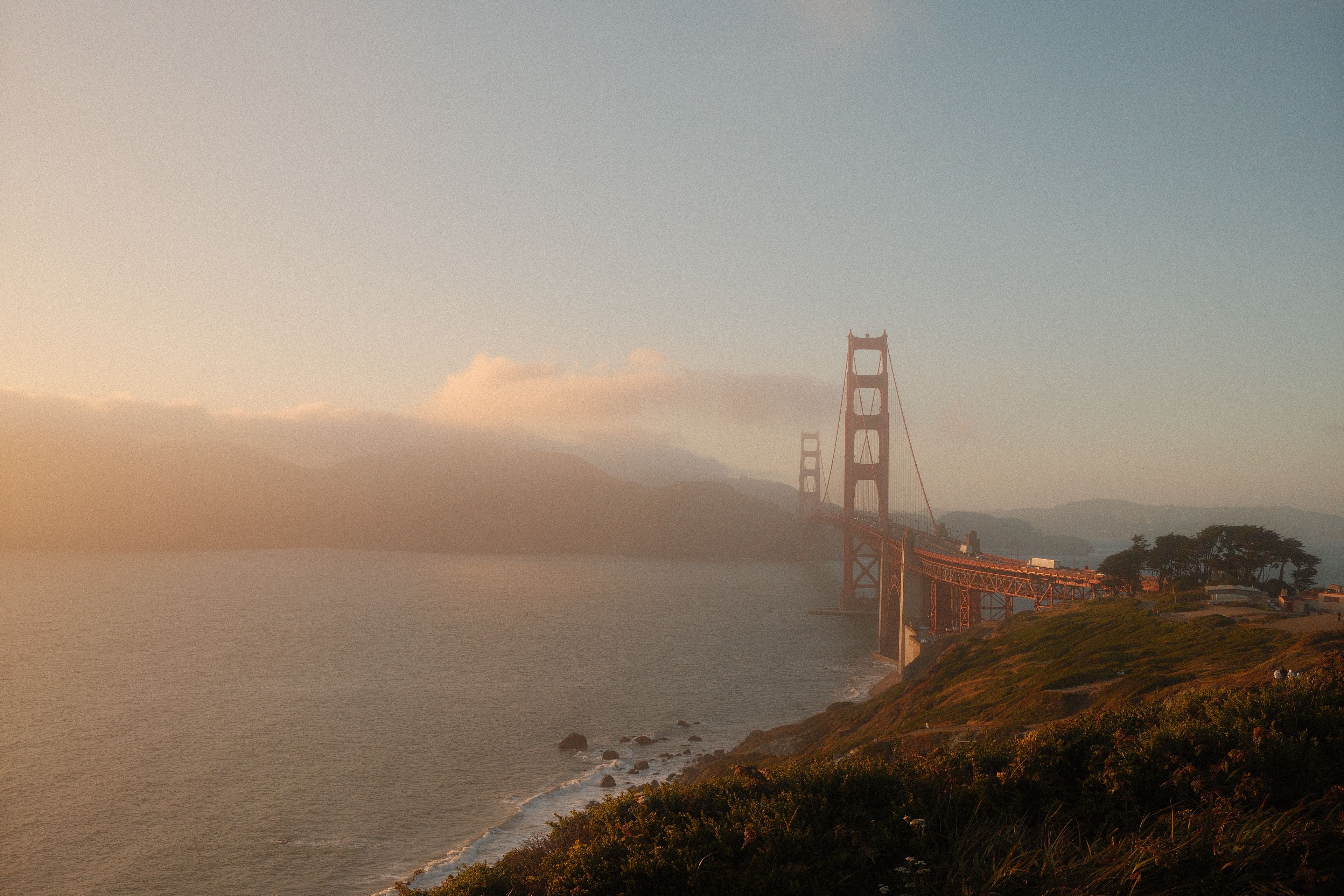 Stunning view of the Golden Gate Bridge during sunset with a misty backdrop in San Francisco.