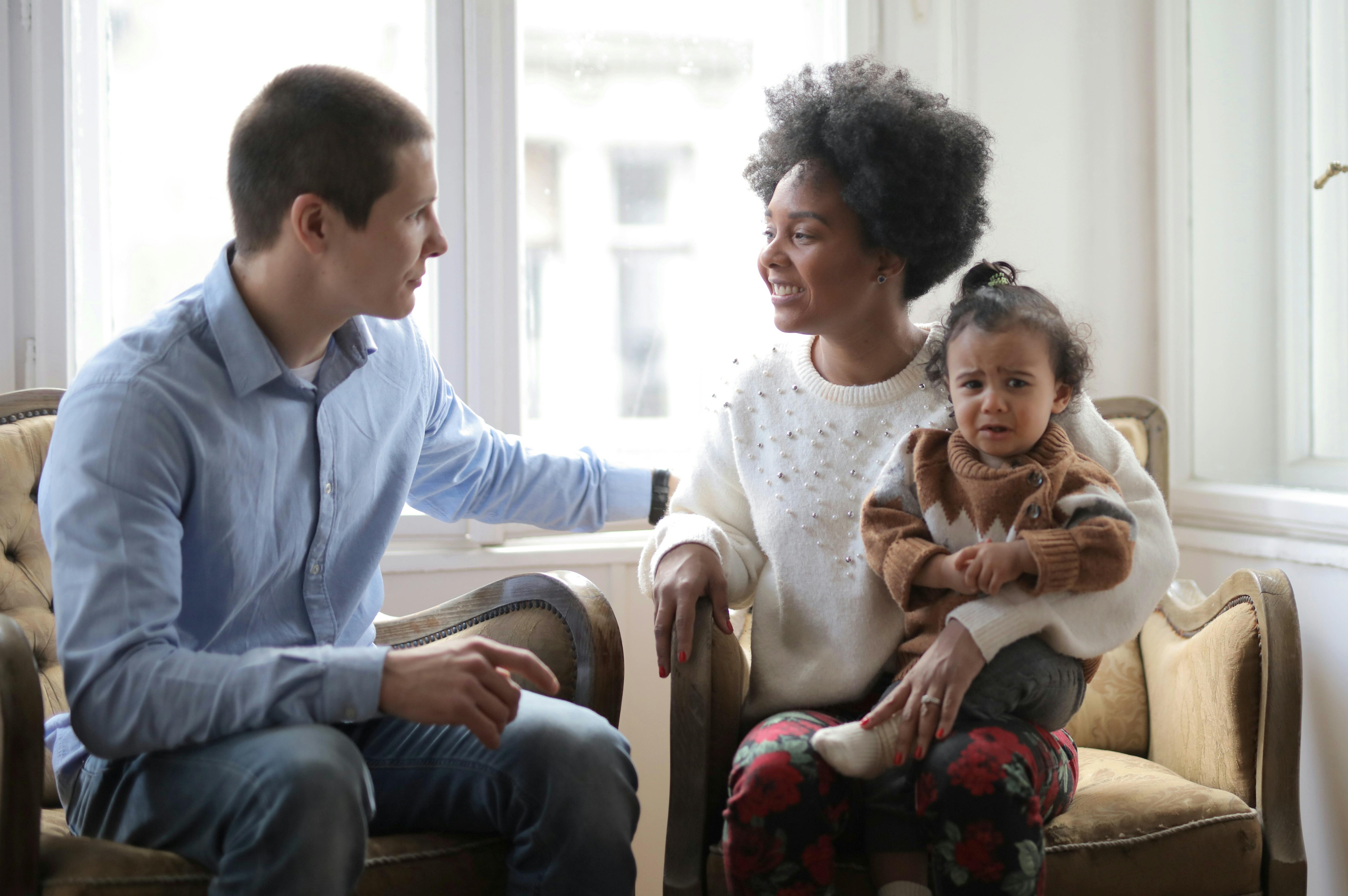 multiethnic family sitting together at home