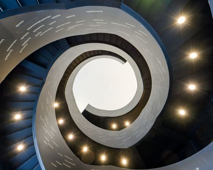 Captivating view of a spiral staircase from below, highlighting architectural beauty.