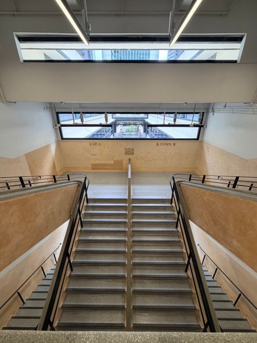Free Symmetrical view of a staircase in a modern Hong Kong building with natural lighting. Stock Photo