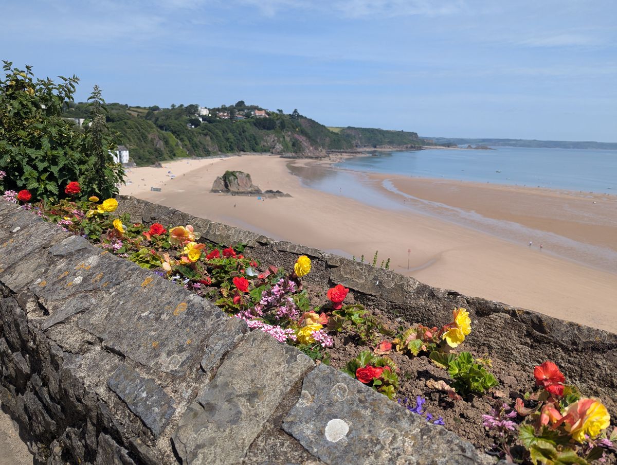 Tenby holiday view of North Beach from the medieval castle walls, with sand and cliffs