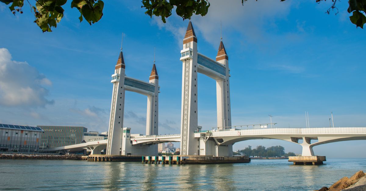 Capture of Terengganu's iconic drawbridge with clear blue skies and calm waters.