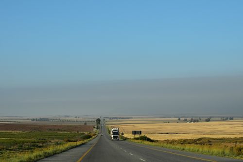Free Open road stretching through the vast South African countryside, perfect for travel and adventure enthusiasts. Stock Photo