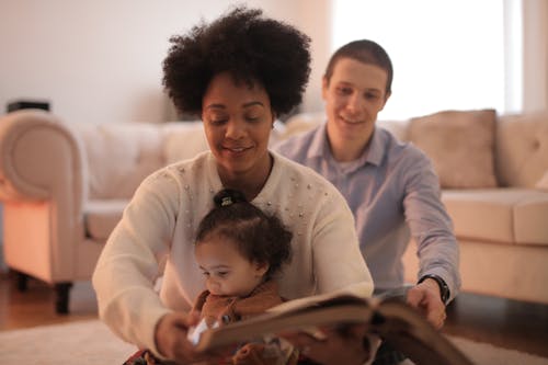 Photo of Woman Holding a Book