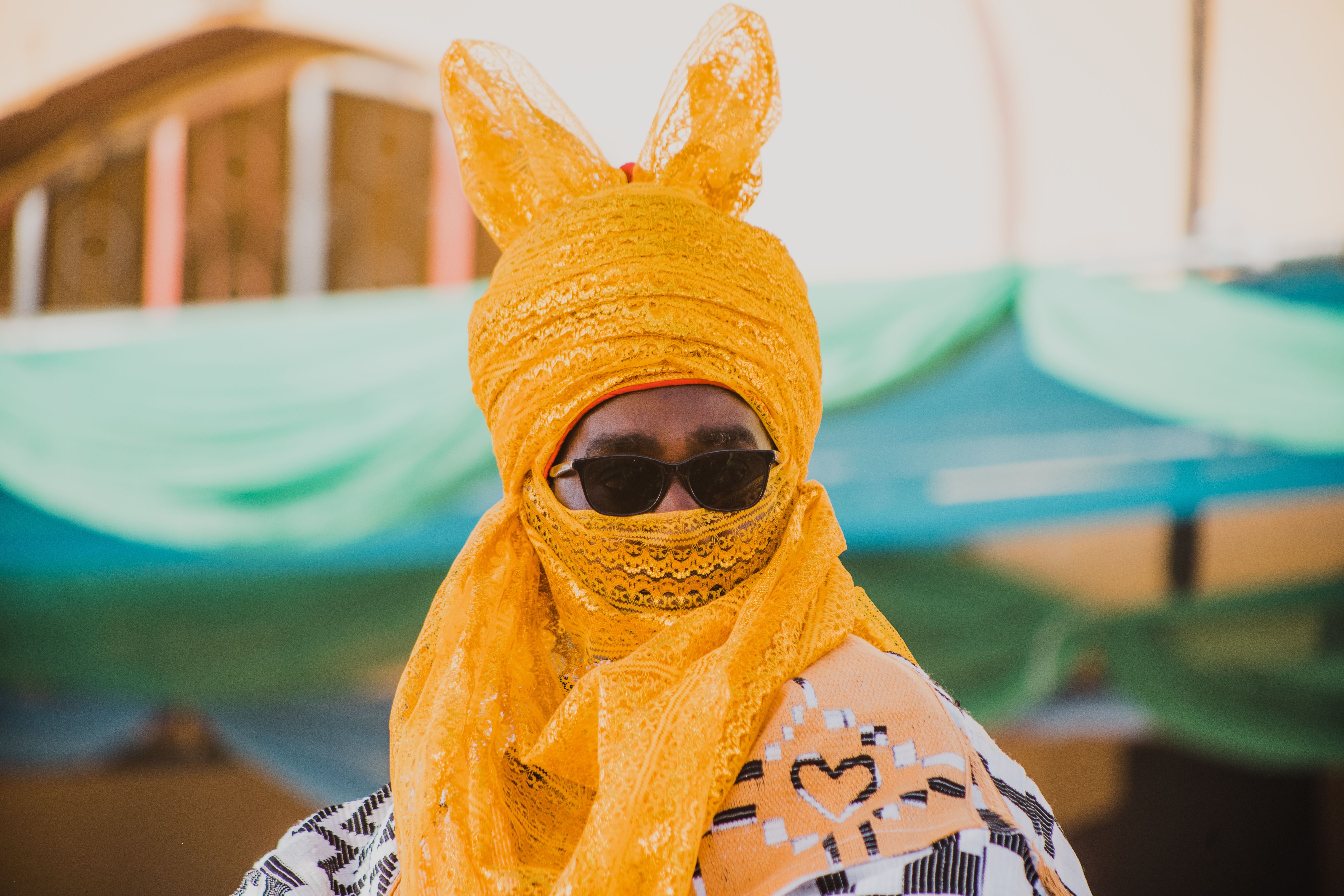 Man in traditional yellow garb and sunglasses, Lesotho