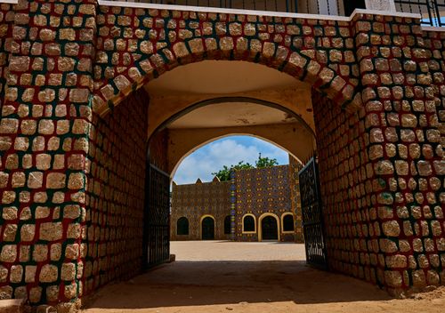 Free Vibrant traditional architecture at the entrance of a palace in Dutse, Nigeria. Stock Photo