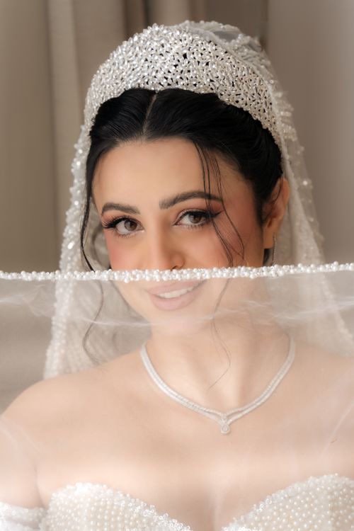 Free Close-up of a bride with elegant pearled veil in Dubai, showcasing grace and beauty. Stock Photo