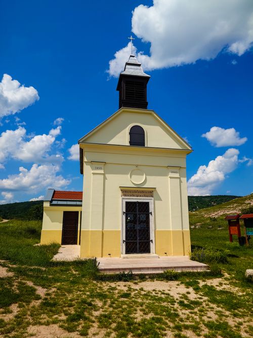 Free A picturesque chapel stands under a clear blue sky in Budaörs, Hungary. Stock Photo