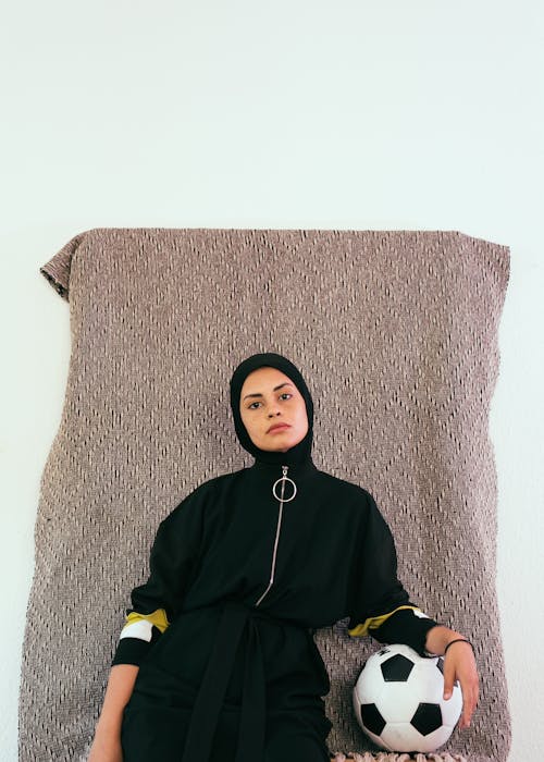 Photo Of Woman In Black HIjab Holding Soccer Ball 