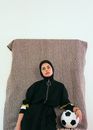 Photo Of Woman In Black HIjab Holding Soccer Ball
