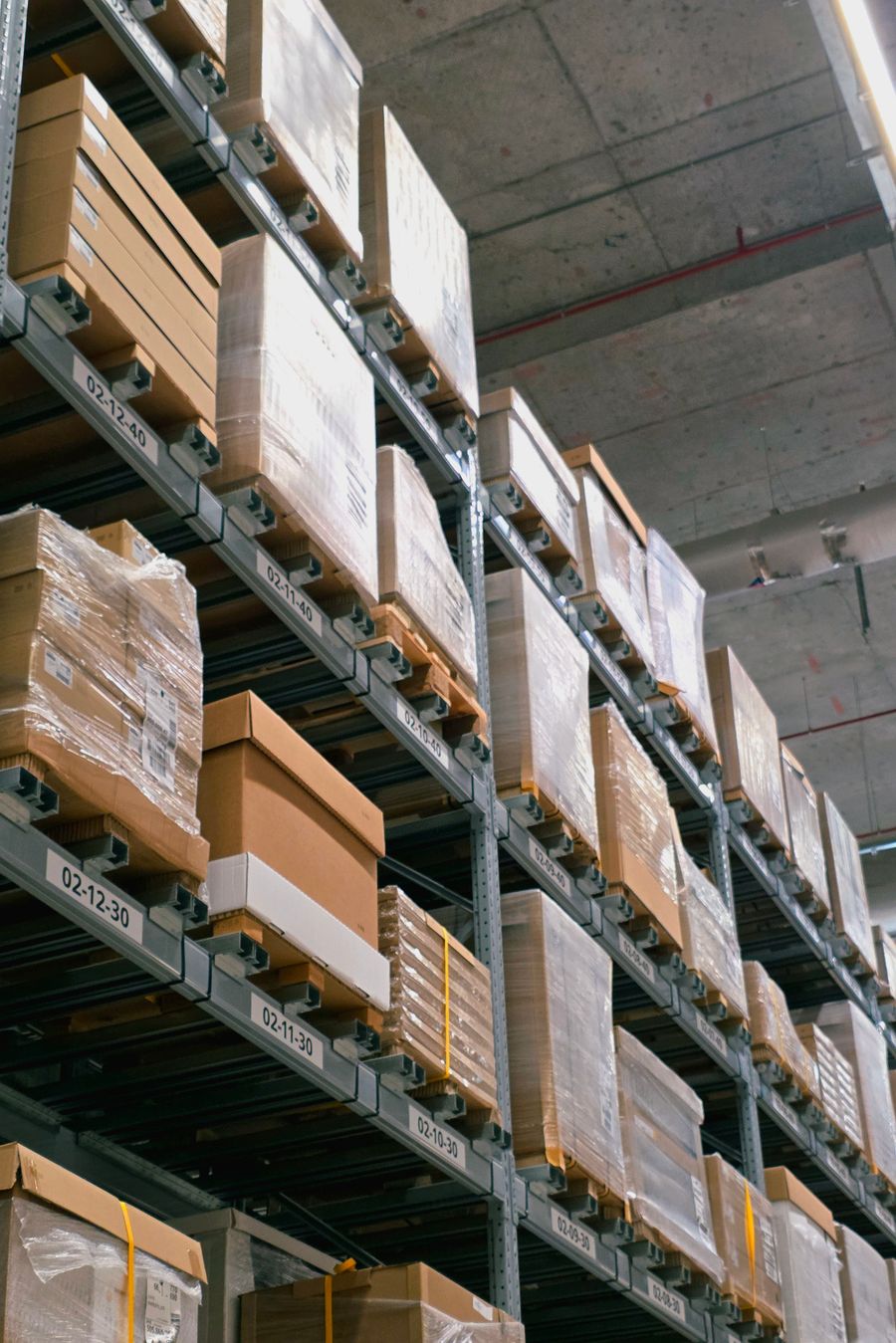 Warehouse shelving with stacked packaging
