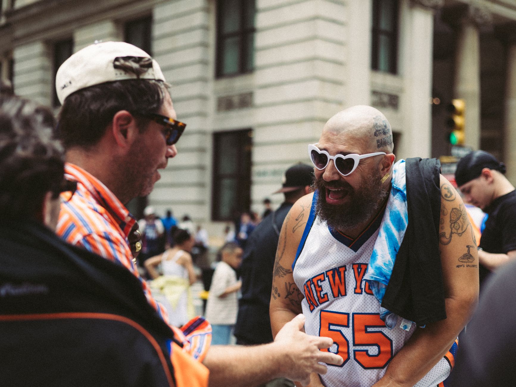 Lively interaction between sports fans on a bustling street in summer.