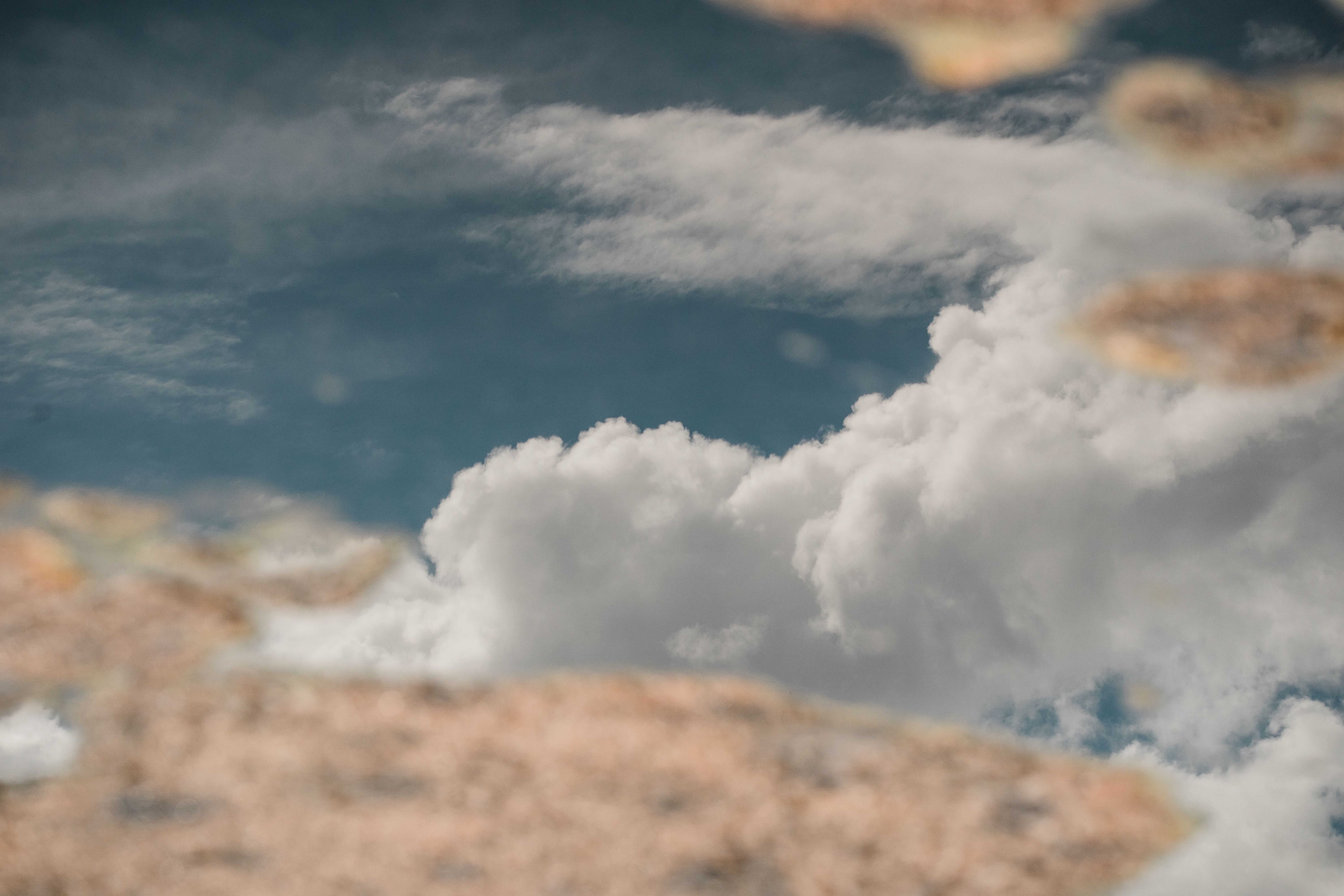 Capture of clouds reflected in a desert puddle, showcasing nature's artistry.