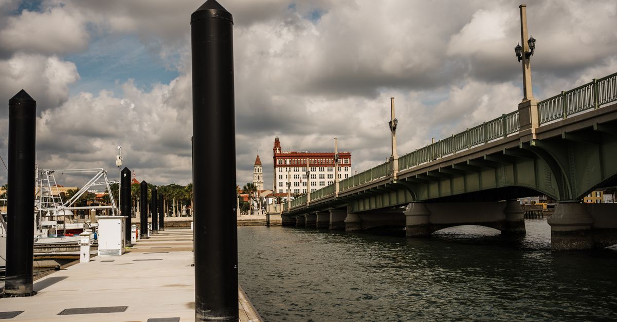 A view of the Bridge of Lions in St. Augustine, Florida, under a cloudy sky.