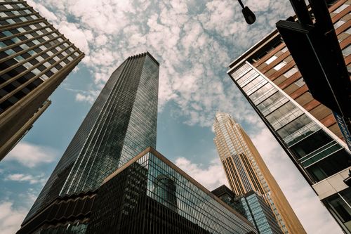 Free Upward view of modern skyscrapers in downtown Minneapolis under a cloudy sky. Stock Photo
