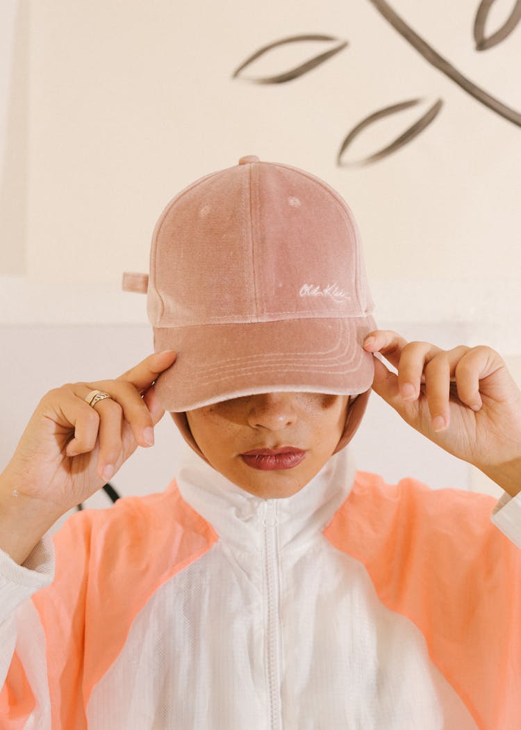 Serious Female Model In Trendy Cap In Studio