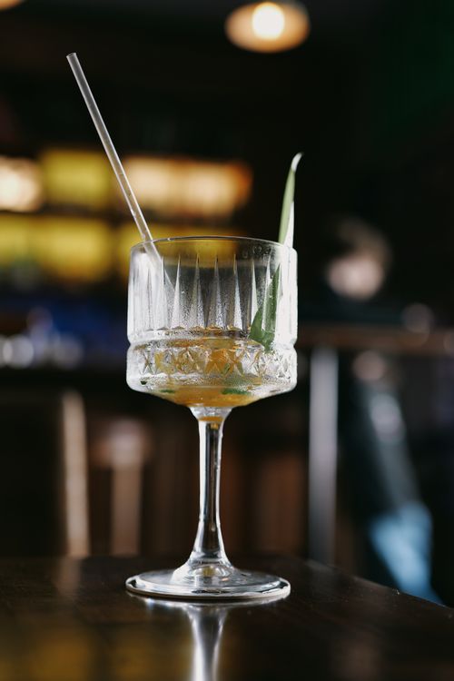 Free Close-up of a stylish cocktail in a crystal glass on a bar table in Kyiv, Ukraine. Stock Photo