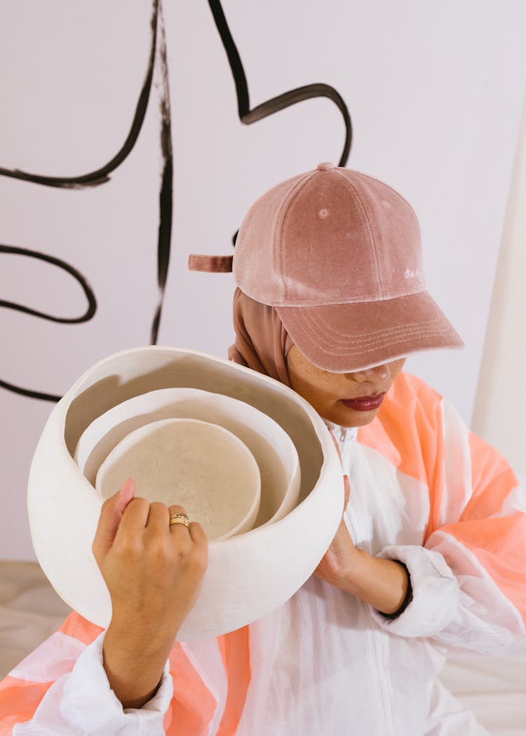 Stylish Woman With Ceramic Bowls In Creative Studio