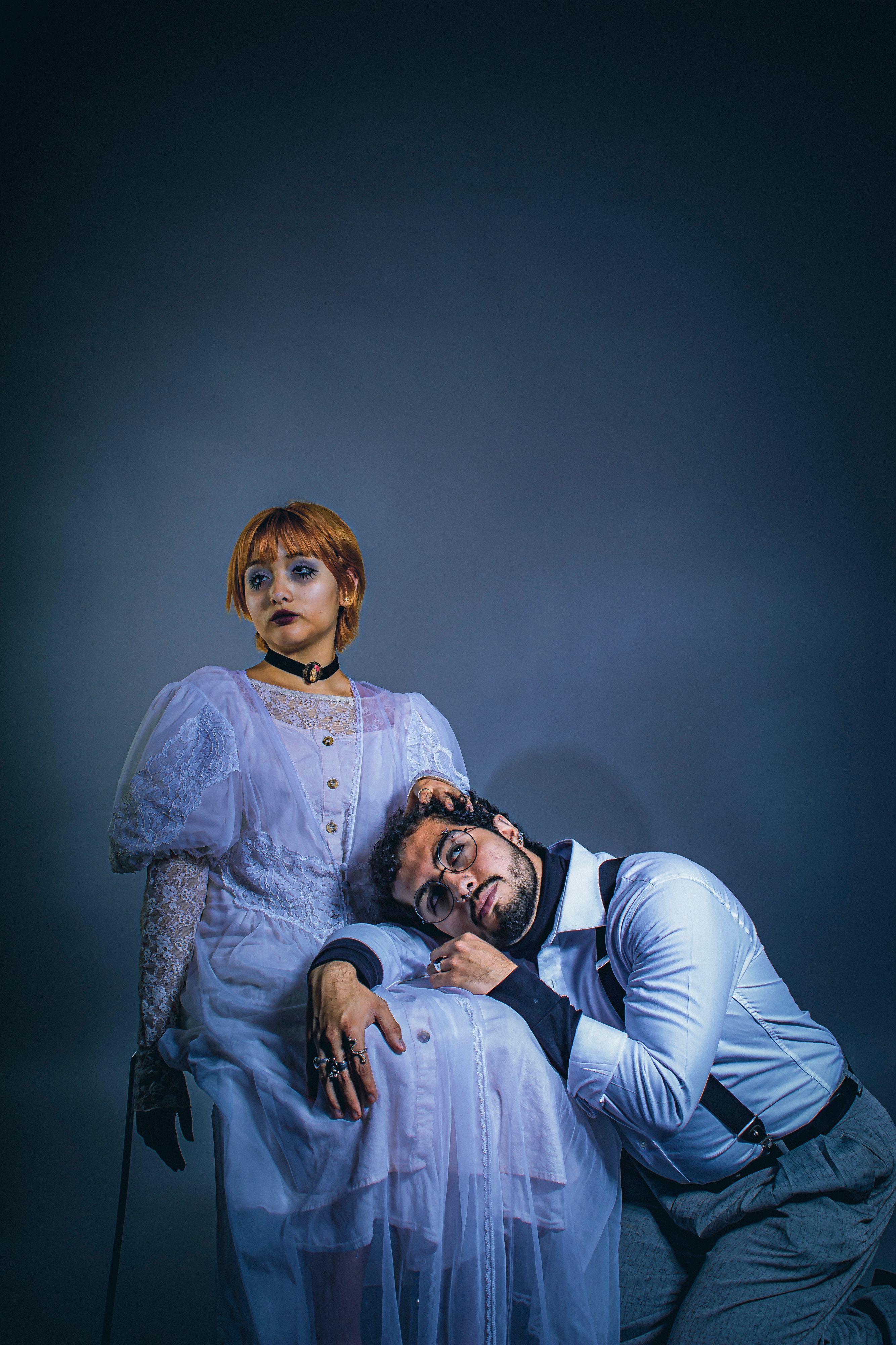 A gothic Victorian inspired portrait of a man and woman showcasing vintage fashion.. gothic, victorian, inspired