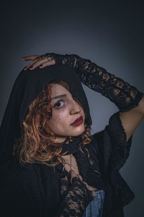 Free Dramatic portrait of a woman in lace and veil with Victorian style elements. Stock Photo