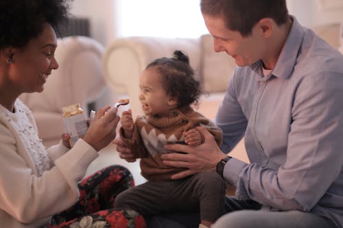 Free Photo of Woman Feeding Her Child Stock Photo