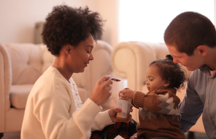 Photo Of Woman Feeding Her Child