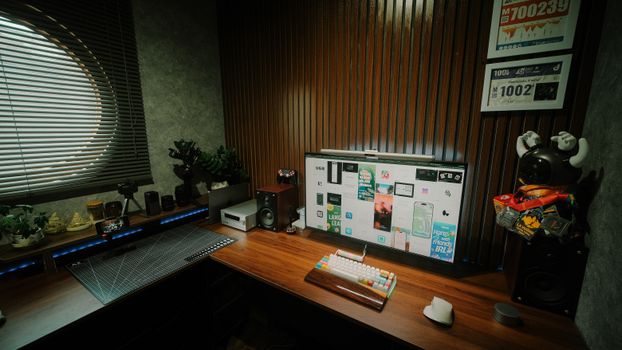 Stylish home office with tech gadgets, gaming decor, and ambient lighting.