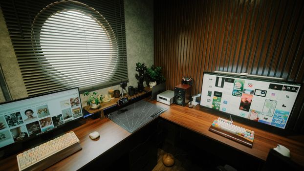 A modern home office setup with dual monitors, plants, and wooden decor, exuding a minimalist vibe.