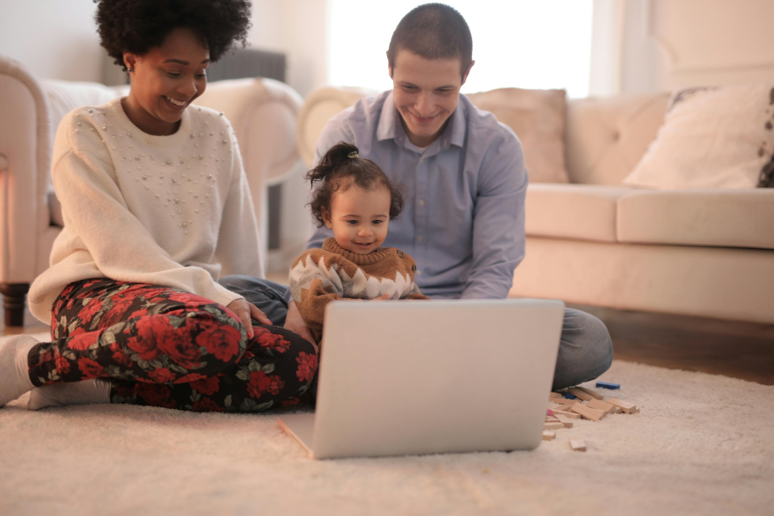 photo of family sitting on floor