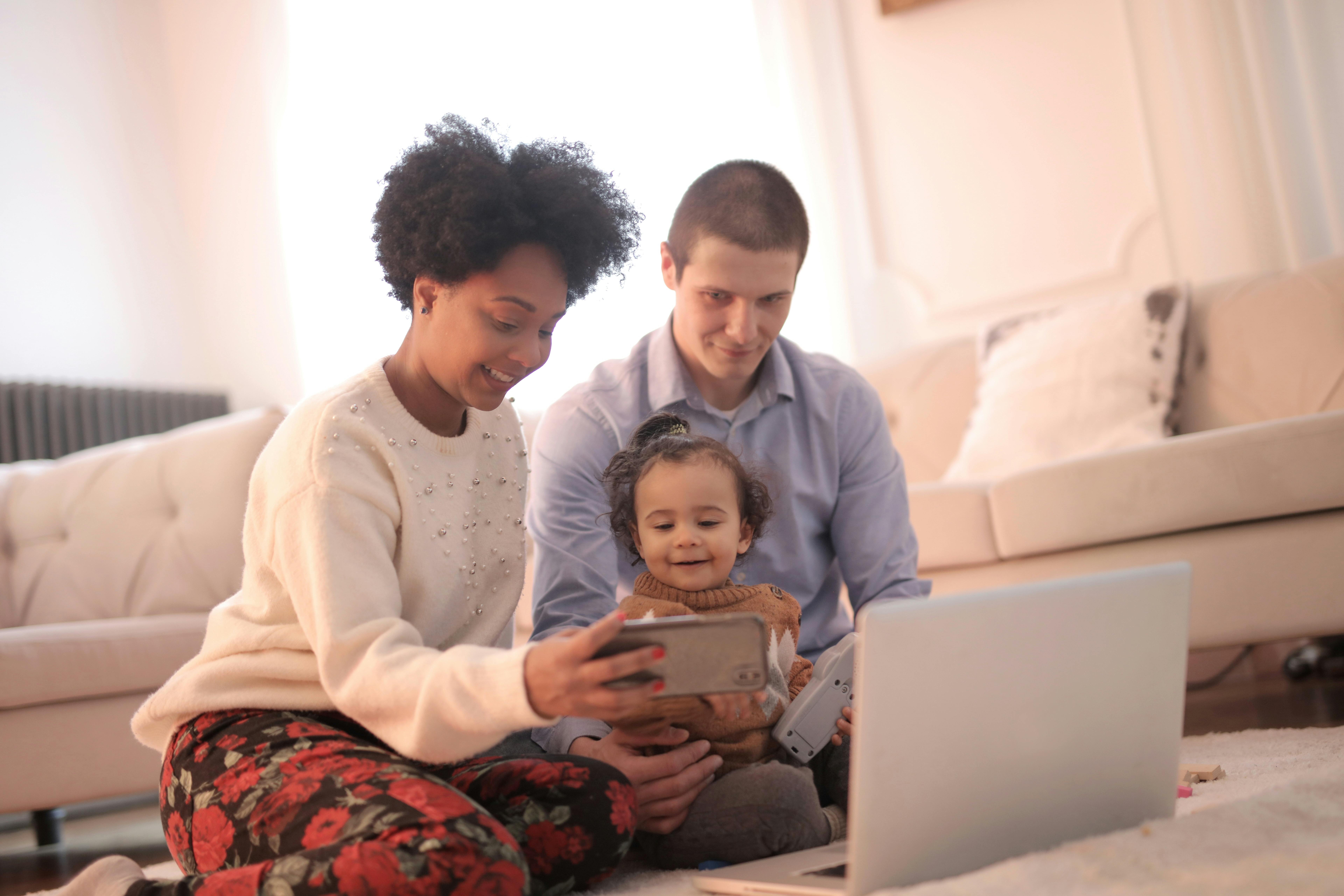 photo of woman taking selfie with her family