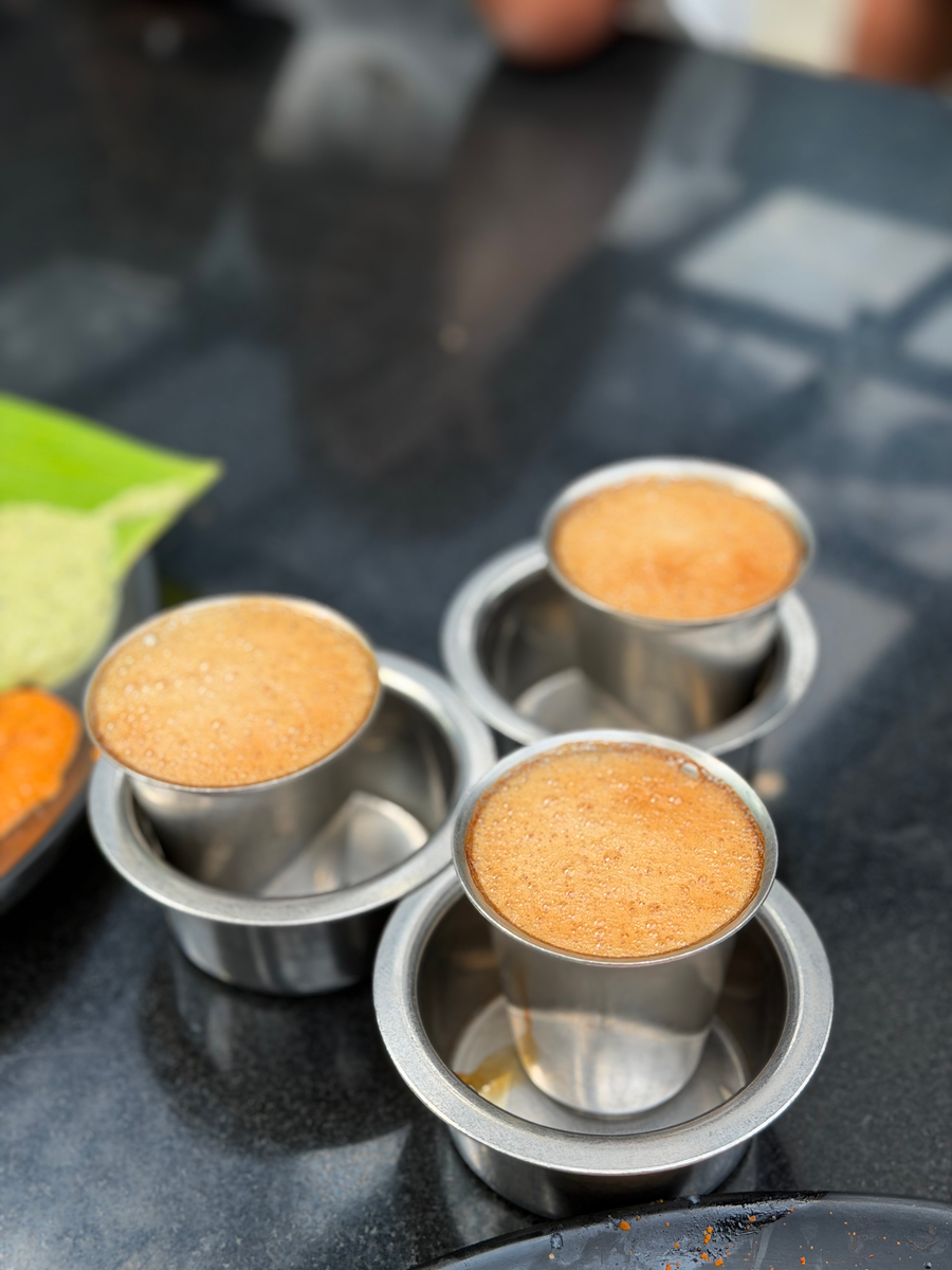 Filter coffee served in traditional steel tumblers
