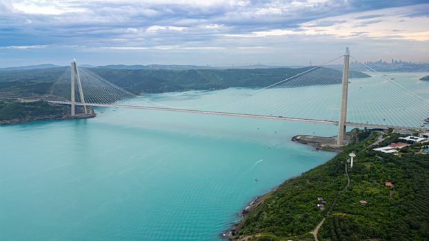 Stunning aerial view of Yavuz Sultan Selim Bridge spanning the Bosphorus Strait in Istanbul, Türkiye.
