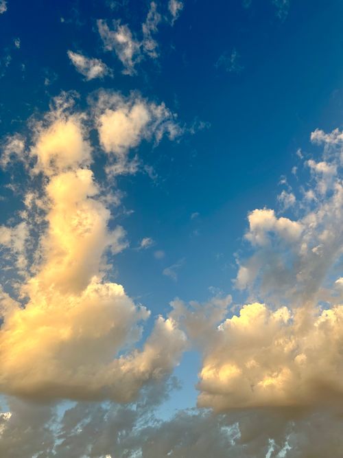 Free Vibrant cloud formations against a deep blue sky at sunset in Cape Town, South Africa. Stock Photo
