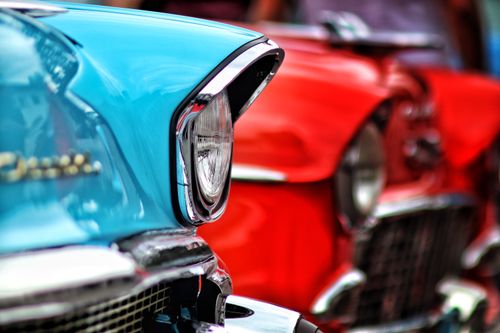 Free Vibrant close-up of vintage cars at a car show in Bandung. Bright colors. Stock Photo
