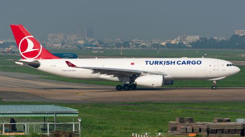 Free Turkish Cargo Airbus A330-200F preparing for takeoff on a clear day at the airport. Stock Photo