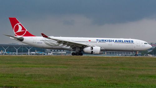 Free Turkish Airlines Airbus A330 airplane preparing for takeoff at an airport. Stock Photo