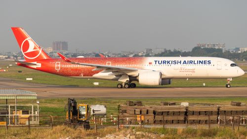 Free Turkish Airlines Airbus A350 on the tarmac with striking red livery. Stock Photo