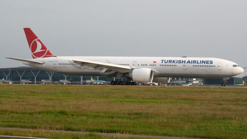 Free Turkish Airlines Boeing 777 preparing for takeoff on airport runway. Stock Photo