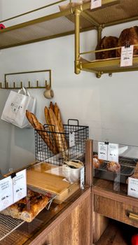 Warm and inviting bakery featuring fresh baguettes and pastries on display, perfect for bread lovers.
