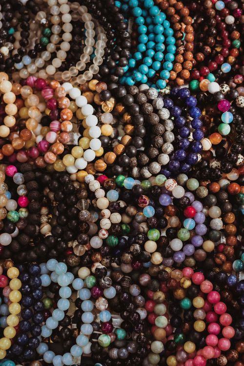 Free A vibrant display of handmade beaded jewelry showcasing African artistry and cultural diversity. Stock Photo