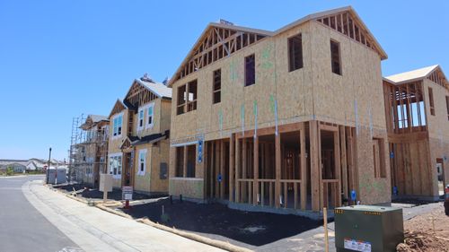 Free Wood-framed houses under construction on a sunny day in Elk Grove, California. Stock Photo