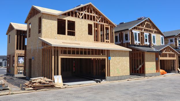 Wooden frame of a new house under construction in Elk Grove, CA, showcasing modern architecture in progress.